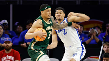 Mar 16, 2025; Fort Worth, TX, USA;  UAB Blazers forward Yaxel Lendeborg (3) drives to the basket as Memphis Tigers forward Nicholas Jourdain (2) defends during the first half at Dickies Arena. Mandatory Credit: Chris Jones-Imagn Images
