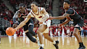 Dec 6, 2025; North Little Rock, Arkansas, USA; Arkansas Razorbacks guard Darius Acuff Jr (5) reaches for the ball between Fresno State Bulldogs guards DJ Stickman (6) and Zaon Collins (10) during the second half at Simmons Bank Arena. Arkansas won 82-58.