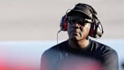 Sep 1, 2024; Darlington, South Carolina, USA; NASCAR Cup Series Team 23XI owner Michael Jordan watches a video board during the Cook Out Southern 500 at Darlington Raceway. Mandatory Credit: Jasen Vinlove-Imagn Images