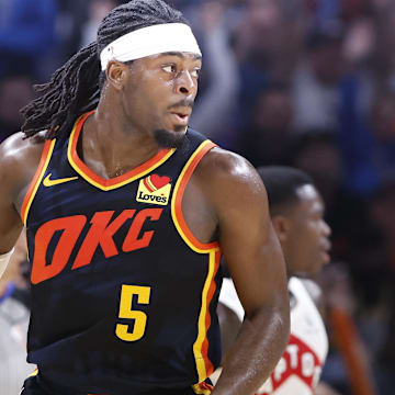 Feb 4, 2024; Oklahoma City, Oklahoma, USA; Oklahoma City Thunder guard Luguentz Dort (5) gestures after scoring a three point basket against the Toronto Raptors during the second half at Paycom Center. Mandatory Credit: Alonzo Adams-Imagn Images