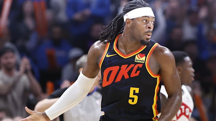 Feb 4, 2024; Oklahoma City, Oklahoma, USA; Oklahoma City Thunder guard Luguentz Dort (5) gestures after scoring a three point basket against the Toronto Raptors during the second half at Paycom Center. Mandatory Credit: Alonzo Adams-Imagn Images