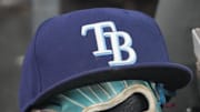 Sep 26, 2025; Toronto, Ontario, CAN; The hat and glove of Tampa Bay Rays third baseman Junior Caminero (13) in the dugout during the game against the Toronto Blue Jays at Rogers Centre. 
