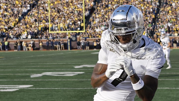 Nov 2, 2024; Ann Arbor, Michigan, USA;  Oregon Ducks wide receiver Evan Stewart (7) celebrates a touchdown in the first half against the Michigan Wolverines at Michigan Stadium.