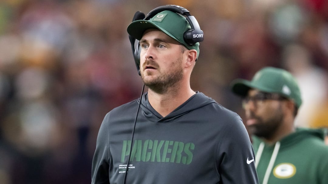 Oct 19, 2025; Glendale, Arizona, USA; Green Bay Packers quarterbacks coach Sean Mannion against the Arizona Cardinals at State Farm Stadium. Mandatory Credit: Mark J. Rebilas-Imagn Images