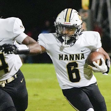 T.L. Hanna High runs behind blocking by teammate playing Hillcrest High during the first quarter in Simpsonville, S.C. Friday, October 3, 2025.