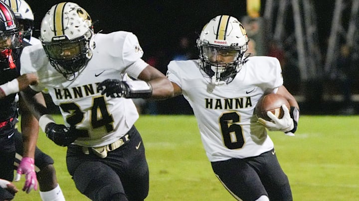 T.L. Hanna High runs behind blocking by teammate playing Hillcrest High during the first quarter in Simpsonville, S.C. Friday, October 3, 2025.