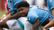 Tennessee Titans wide receiver Treylon Burks (16) and wide receiver Kyle Philips (18) stretch at Ascension Saint Thomas Sports Park in Nashville at a joint practice with the Seattle Seahawks.
