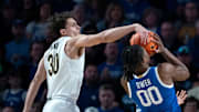 Vanderbilt Commodores guard Chris Manon (30) pressures Kentucky Wildcats guard Otega Oweh (00) on his shot during their game at Memorial Gym in Nashville, Tenn., Saturday, Jan. 25, 2025.
