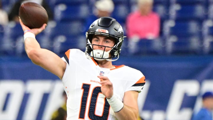 Aug 11, 2024; Indianapolis, Indiana, USA; Denver Broncos quarterback Bo Nix (10) throws a warm up ball before the game against the Indianapolis Colts at Lucas Oil Stadium. 