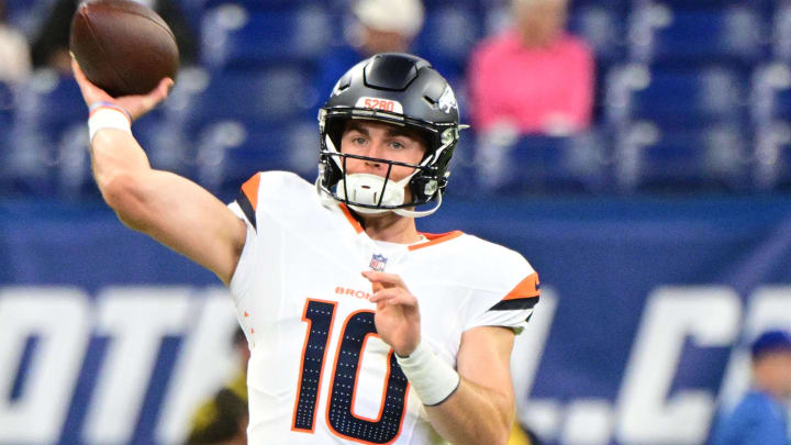 Aug 11, 2024; Indianapolis, Indiana, USA; Denver Broncos quarterback Bo Nix (10) throws a warm up ball before the game against the Indianapolis Colts at Lucas Oil Stadium. Mandatory Credit: Marc Lebryk-USA TODAY Sports