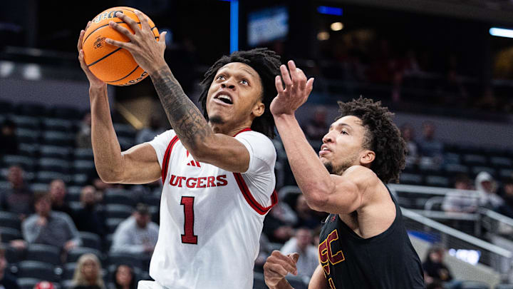 Mar 12, 2025; Indianapolis, IN, USA; Rutgers Scarlet Knights guard Jamichael Davis (1) shoots the ball while USC Trojans guard Desmond Claude (1) defends in the second half at Gainbridge Fieldhouse. Mandatory Credit: Trevor Ruszkowski-Imagn Images Mar 12, 2025; Indianapolis, IN, USA; Rutgers Scarlet Knights guard Jamichael Davis (1) shoots the ball while USC Trojans guard Desmond Claude (1) defends in the second half at Gainbridge Fieldhouse. Mandatory Credit: Trevor Ruszkowski-Imagn Images