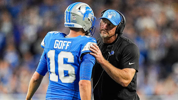 Detroit Lions quarterback Jared Goff (16) talks to head coach Dan Campbell at a timeout against Los Angeles Rams during the first half at Ford Field in Detroit on Sunday, September 8, 2024.