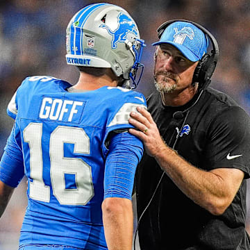 Detroit Lions quarterback Jared Goff (16) talks to head coach Dan Campbell at a timeout against Los Angeles Rams 