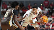 The Ville’s Jay Scrubb dribbles the ball against Boston Vs Cancer’ Octavio Brito Saturday at Freedom Hall