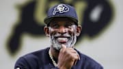 Apr 4, 2025; Boulder, CO, USA; Colorado Buffaloes head coach Deion Sanders watches as his players go through drills at the University of Colorado NFL Showcase at the CU Indoor Practice Facility. Mandatory Credit: Michael Ciaglo-Imagn Images
