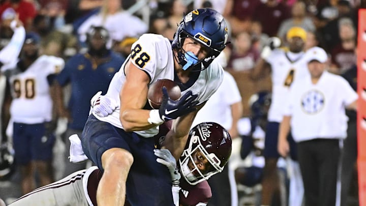 Toledo Rockets tight end Anthony Torres (88) makes a reception as he is hit by Mississippi State Bulldogs safety Isaac Smith (2) during the second quarter at Davis Wade Stadium at Scott Field.