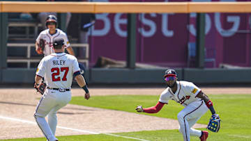 Jul 6, 2025; Cumberland, Georgia, USA; A ball hit by Baltimore Orioles second baseman Jackson Holliday (7) (not pictured) drops for a hit between Atlanta Braves third baseman Austin Riley (27) and left fielder Jurickson Profar (7) during the first inning at Truist Park. Mandatory Credit: Dale Zanine-Imagn Images