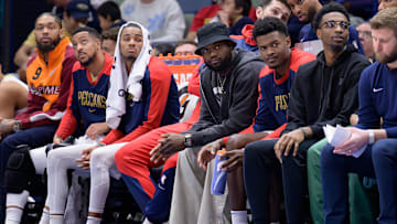 Jan 15, 2025; New Orleans, Louisiana, USA; New Orleans Pelicans forward Brandon Ingram, guard CJ McCollum, guard Dejounte Murray, forward Zion Williamson, center Yves Missi, and forward Herbert Jones watch from the bench during the second half against the Dallas Mavericks at Smoothie King Center. Mandatory Credit: Matthew Hinton-Imagn Images