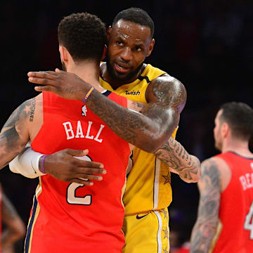 January 3, 2020; Los Angeles, California, USA; Los Angeles Lakers forward LeBron James (23) meets with New Orleans Pelicans guard Lonzo Ball (2) following the 123-113 victory at Staples Center. Mandatory Credit: Gary A. Vasquez-Imagn Images