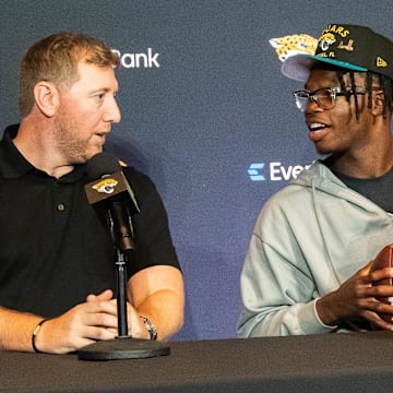 Jacksonville Jaguars Head Coach Liam Coen, left, talks with the team’s first-round pick, Colorado Buffaloes wide receiver and defensive back Travis Hunter, right, Friday, March 25, 2025 at Miller Electric Center in Jacksonville, Fla. during a press conference. [Doug Engle/Florida Times-Union]