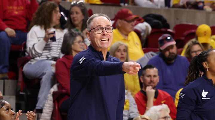 Jan 11, 2026; Ames, Iowa, USA; West Virginia Mountaineers head coach Mark Kellogg watches his team play the Iowa State Cyclones during the first half at James H. Hilton Coliseum. Mandatory Credit: Reese Strickland-Imagn Images
