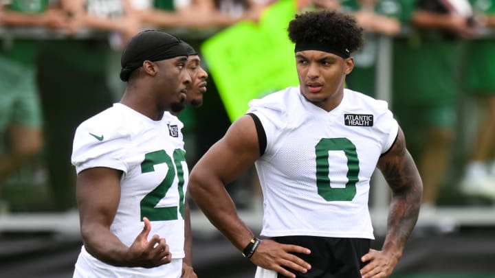 Jul 25, 2024; Florham Park, NJ, USA; New York Jets running back Breece Hall (20) talks to running back Braelon Allen (0) during training camp at Atlantic Health Jets Training Center.