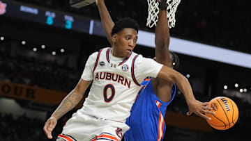 Apr 5, 2025; San Antonio, TX, USA;  Auburn Tigers guard Tahaad Pettiford (0) passes the ball against the Florida Gators in the semifinals of the men's Final Four of the 2025 NCAA Tournament at the Alamodome. Mandatory Credit: Robert Deutsch-Imagn Images