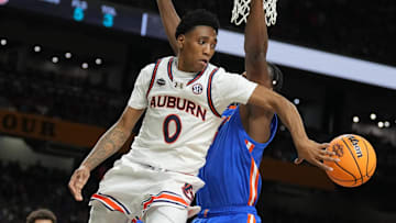 Apr 5, 2025; San Antonio, TX, USA;  Auburn Tigers guard Tahaad Pettiford (0) passes the ball against the Florida Gators in the semifinals of the men's Final Four of the 2025 NCAA Tournament at the Alamodome.