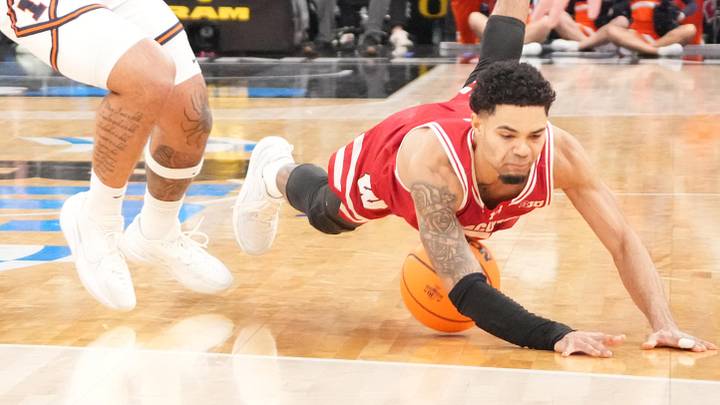 Mar 13, 2026; Chicago, IL, USA; Wisconsin Badgers guard Nick Boyd (2) dives for the ball against the Illinois Fighting Illini during the second half at United Center. Mandatory Credit: David Banks-Imagn Images