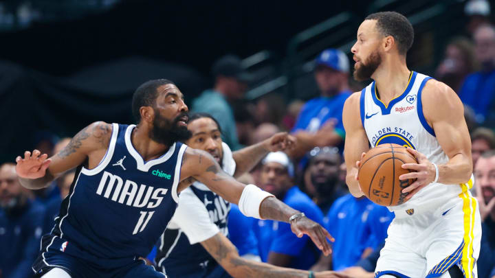 Apr 5, 2024; Dallas, Texas, USA;  Golden State Warriors guard Stephen Curry (30) looks to score as Dallas Mavericks guard Kyrie Irving (11) defends during the first quarter at American Airlines Center. Mandatory Credit: Kevin Jairaj-USA TODAY Sports