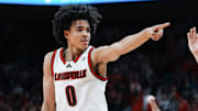 Louisville Cardinals guard Mikel Brown Jr. (0) celebrates his three-point shot as the Cards go up over Kentucky in the first half during the UofL-UK annual rivalry game at the KFC Yum! Center in Louisville, Kentucky Nov. 11, 2025.