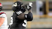 Vanderbilt Commodores defensive lineman De'Marion Thomas (98) celebrates his sack against the Ball State Cardinals quarterback Kadin Semonza (3) during the first half at FirstBank Stadium.