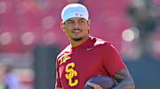 Oct 11, 2025; Los Angeles, California, USA;  USC Trojans quarterback Jayden Maiava (14) warms up prior to the game against the Michigan Wolverines at United Airlines Field at the Los Angeles Memorial Coliseum. Mandatory Credit: Jayne Kamin-Oncea-Imagn Images