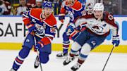 Nov 8, 2025; Edmonton, Alberta, CAN; Edmonton Oilers forward Connor McDavid (97) looks to make a play in front of Colorado Avalanche defensemen Cale Makar (8) during the third period at Rogers Place. Mandatory Credit: Perry Nelson-Imagn Images
