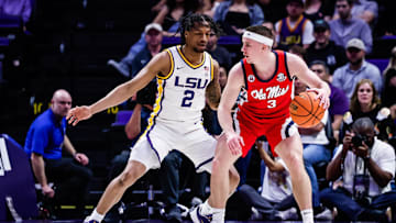 Feb 8, 2025; Baton Rouge, Louisiana, USA; Mississippi Rebels guard Sean Pedulla (3) dribbles against LSU Tigers guard Mike Williams III (2) during the first half at Pete Maravich Assembly Center. Mandatory Credit: Stephen Lew-Imagn Images