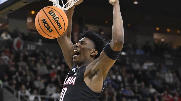 Mar 20, 2025; Providence, RI, USA;  Omaha Mavericks forward Marquel Sutton (10) scores against St. John's Red Storm during the first half at Amica Mutual Pavilion. Mandatory Credit: Eric Canha-Imagn Images