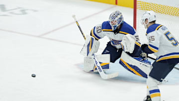 Feb 2, 2025; Salt Lake City, Utah, USA; St. Louis Blues goaltender Jordan Binnington (50) catches the puck during the third period against the Utah Hockey Club at Delta Center. Mandatory Credit: Chris Nicoll-Imagn Images