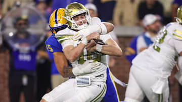 Georgia Tech Yellow Jackets quarterback Haynes King (10) is tackled by Pittsburgh Panthers defensive lineman Joey Zelinsky (45)