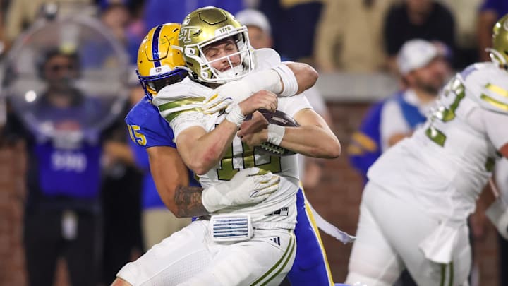 Georgia Tech Yellow Jackets quarterback Haynes King (10) is tackled by Pittsburgh Panthers defensive lineman Joey Zelinsky (45)