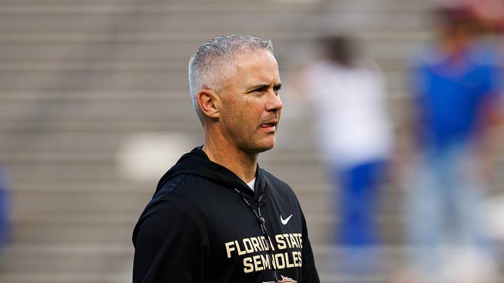 Nov 29, 2025; Gainesville, Florida, USA; Florida State Seminoles head coach Mike Norvell walks on the field before a game against the Florida Gators at Ben Hill Griffin Stadium. Mandatory Credit: Matt Pendleton-Imagn Images