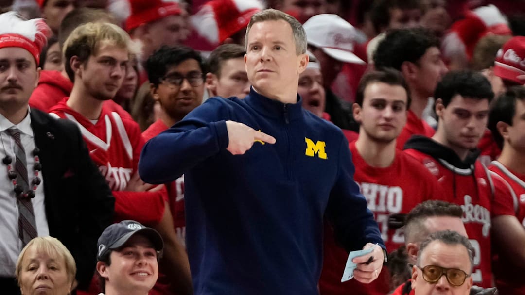 Michigan Wolverines head coach Dusty May motions during the second half of the NCAA men's basketball game against the Ohio State Buckeyes at the Schottenstein Center. Michigan Wolverines head coach Dusty May motions during the second half of the NCAA men's basketball game against the Ohio State Buckeyes at the Schottenstein Center.