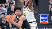 Jan 11, 2025; Columbia, Missouri, USA;Vanderbilt Commodores guard AJ Hoggard (11) looks to pass as Missouri Tigers guard Mark Mitchell (25) defends during the first half at Mizzou Arena. Mandatory Credit: Denny Medley-Imagn Images