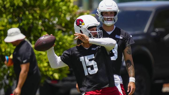 Arizona Cardinals quarterback Gardner Minshew II (15) throws passes in front of quarterback Carson Beck (19) during organized team activities at the Cardinals Training Facility in Tempe on May 27, 2026.