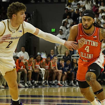 Dec 6, 2024; Evanston, Illinois, USA; Northwestern Wildcats forward Nick Martinelli (2) defends Illinois Fighting Illini guard Kylan Boswell (4) during the first half at Welsh-Ryan Arena. Mandatory Credit: David Banks-Imagn Images