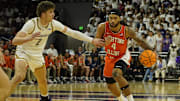 Dec 6, 2024; Evanston, Illinois, USA; Northwestern Wildcats forward Nick Martinelli (2) defends Illinois Fighting Illini guard Kylan Boswell (4) during the first half at Welsh-Ryan Arena. Mandatory Credit: David Banks-Imagn Images