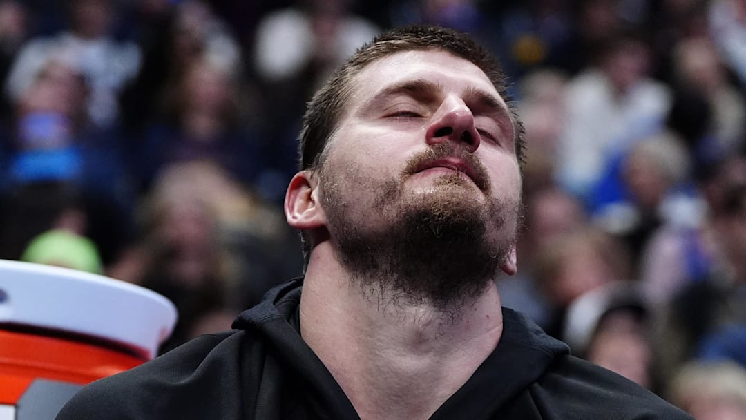 Mar 6, 2026; Denver, Colorado, USA; Denver Nuggets center Nikola Jokic (15) reacts on the bench during the fourth quarter against the New York Knicks at Ball Arena. Mandatory Credit: Ron Chenoy-Imagn Images Mar 6, 2026; Denver, Colorado, USA; Denver Nuggets center Nikola Jokic (15) reacts on the bench during the fourth quarter against the New York Knicks at Ball Arena. Mandatory Credit: Ron Chenoy-Imagn Images