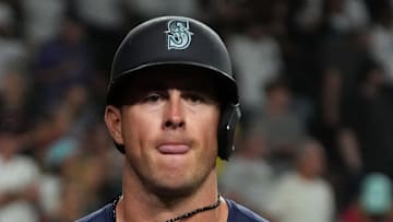 Seattle Mariners second base Dylan Moore (25) scores a run against the Arizona Diamondbacks in the ninth inning at Chase Field on June 9. 