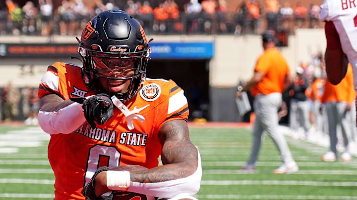 Oklahoma State's Ollie Gordon II (0) celebrates a 2-point conversion front of Jaylon Braxton (11) in double overtime of the college football game between the Oklahoma State Cowboys and the Arkansas Razorbacks at Boone Pickens Stadium in Stillwater, Okla.,, 