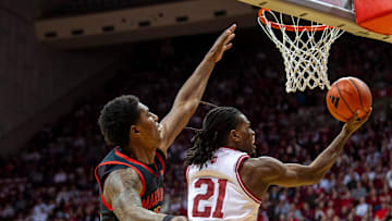 Indiana's Mackenzie Mgbako (21) scores past Maryland's Selton Miguel (10) during Sunday's game in Bloomington. Maryland won, 79-78.