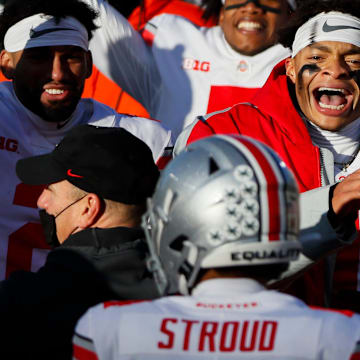 Ohio State Buckeyes quarterback Justin Fields (1) celebrates a rushing touchdown from fellow quarterback C.J. Stroud (14) during the fourth quarter of a NCAA Division I football game between the Michigan State Spartans and the Ohio State Buckeyes on Saturday, Dec. 5, 2020 at Spartan Stadium in East Lansing, Michigan.

Cfb Ohio State Buckeyes At Michigan State Spartans